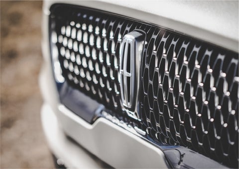 The grille of the 2023 Lincoln Aviator® Reserve model with an eye-catching repeated field of Lincoln Star logo shapes | John Vance Auto Group in Guthrie OK