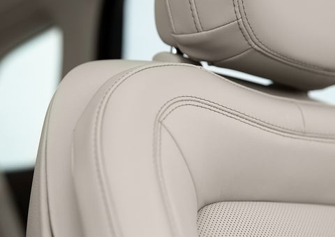 Fine craftsmanship is shown through a detailed image of front-seat stitching. | John Vance Auto Group in Guthrie OK