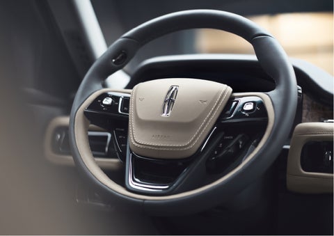 The intuitively placed controls of the steering wheel on a 2023 Lincoln Aviator® SUV | John Vance Auto Group in Guthrie OK