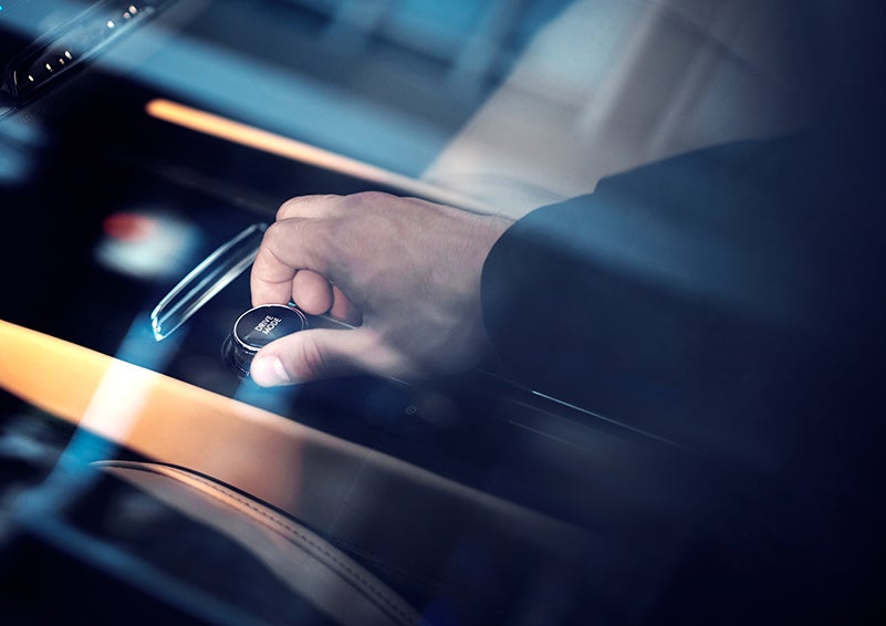 The driver of a 2023 Lincoln Corsair® SUV is shown adjusting the drive mode. | John Vance Auto Group in Guthrie OK